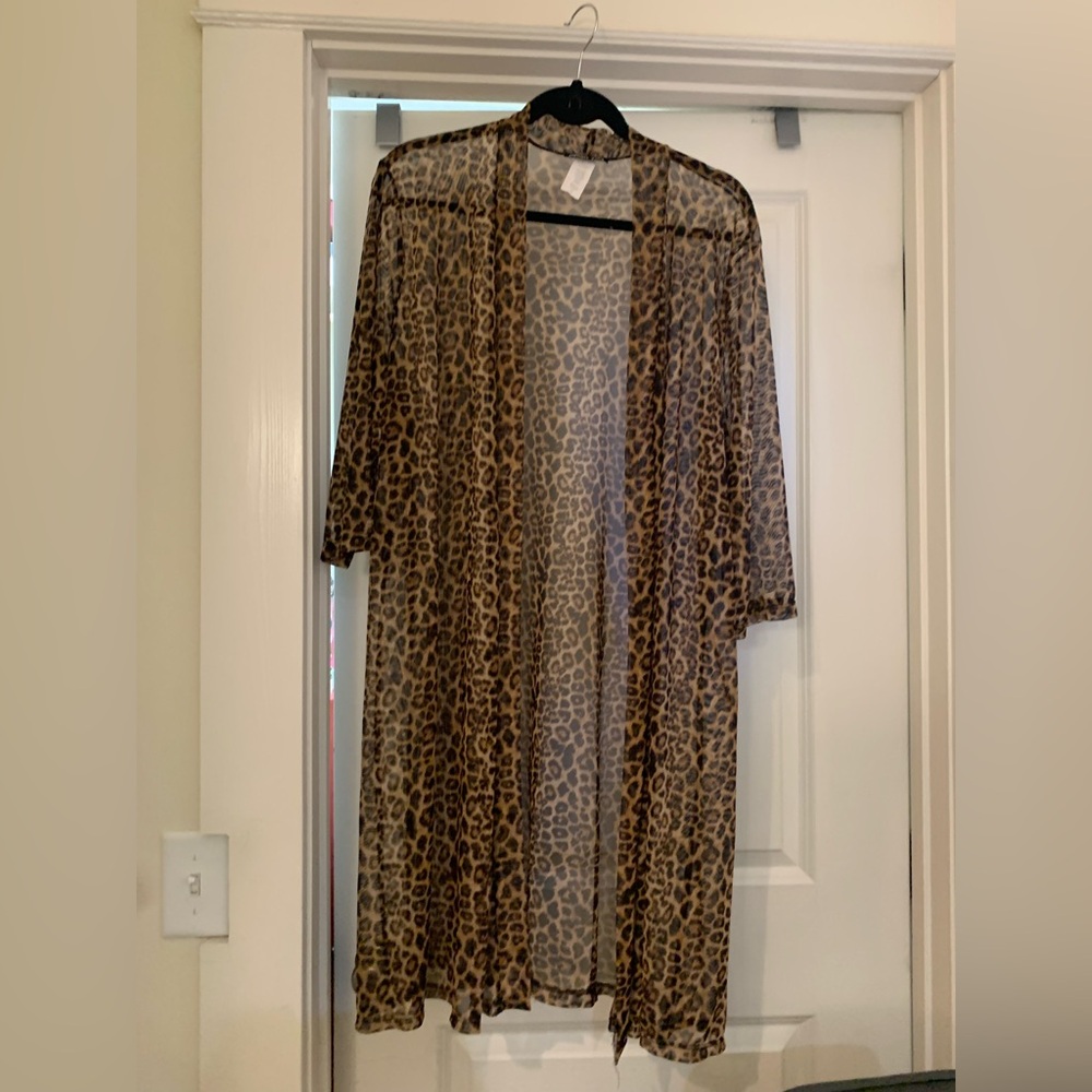 Two Women's sheer dress length jackets.